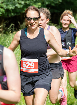 This photo is of Elizabeth McGill. It was taken by Racing Line Running